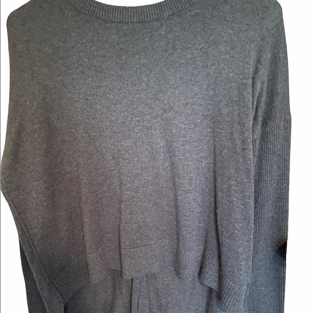 Woman’s Athleta small grey sweater.